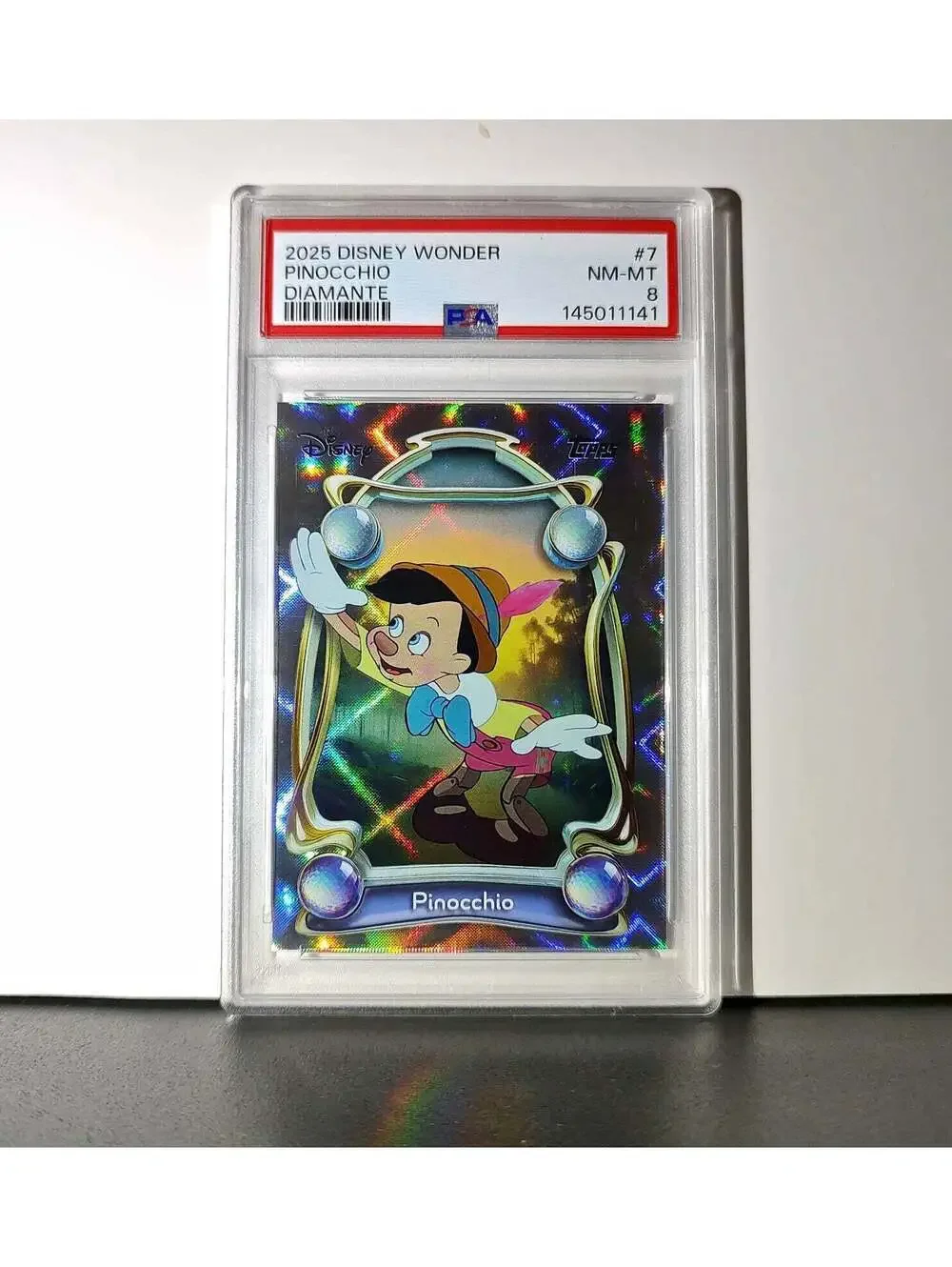 Pinocchio 2025 Topps Disney Wonder #7 Winter Variant Card Pinocchio PSA 8